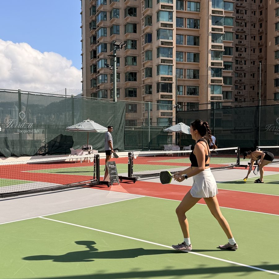 Player on the outdoor pickleball court at Terraza Racquets Club